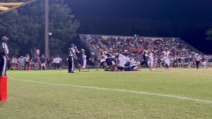 Manchester RB Dior Barnes scores a touchdown in the first half against Midlothian for the Lancers