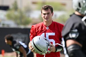 Jun 3, 2026; Henderson, NV, USA; Las Vegas Raiders quarterback Fernando Mendoza (15) warms up during organized team activities at Intermountain Health Performance Center. Mandatory Credit: Candice Ward-Imagn Images