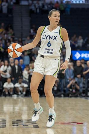 May 23, 2025; Minneapolis, Minnesota, USA; Minnesota Lynx forward Bridget Carleton (6) dribbles the ball against the Connecticut Sun in the first half at Target Center. Mandatory Credit: Jesse Johnson-Imagn Images