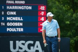 Padraig Harrington walks around the 14th green during the final round of the U.S. Senior Open at Scioto Country Club in Columbus