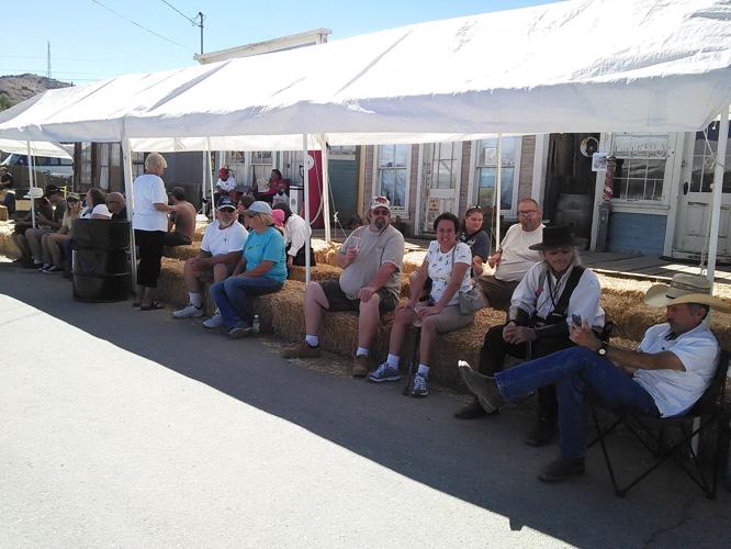Bales of hay are used for sitting along Main Street during Randsburg Old West Days and many folks take advantage of this. Photo by - Patti Orr.jpg