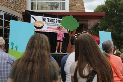Bacon Bash attendees watch attendees “The Thirty-Three Little Pigs - A Theatre Performance” by WonderWorks Theatre on Saturday, Sept. 20.  Kaitlyn Doolittle/Star-Observer.