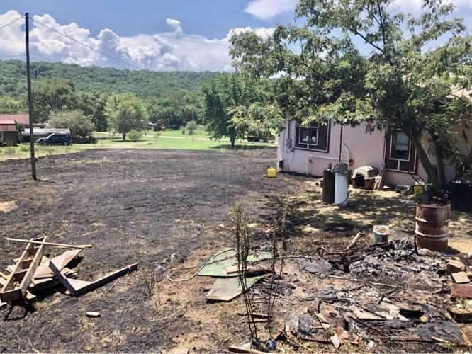 London & Bayliss Fire Departments extinguish grass fire threatening