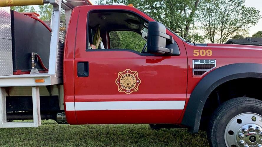 London & Bayliss Fire Departments extinguish grass fire threatening