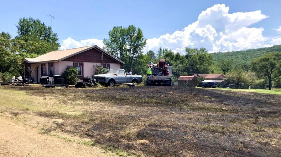 London & Bayliss Fire Departments extinguish grass fire threatening