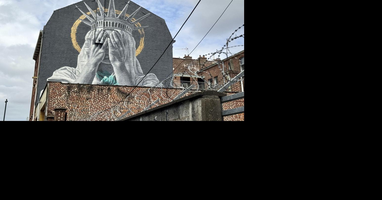 A new mural in France shows the Statue of Liberty covering her eyes in a swipe at Trump