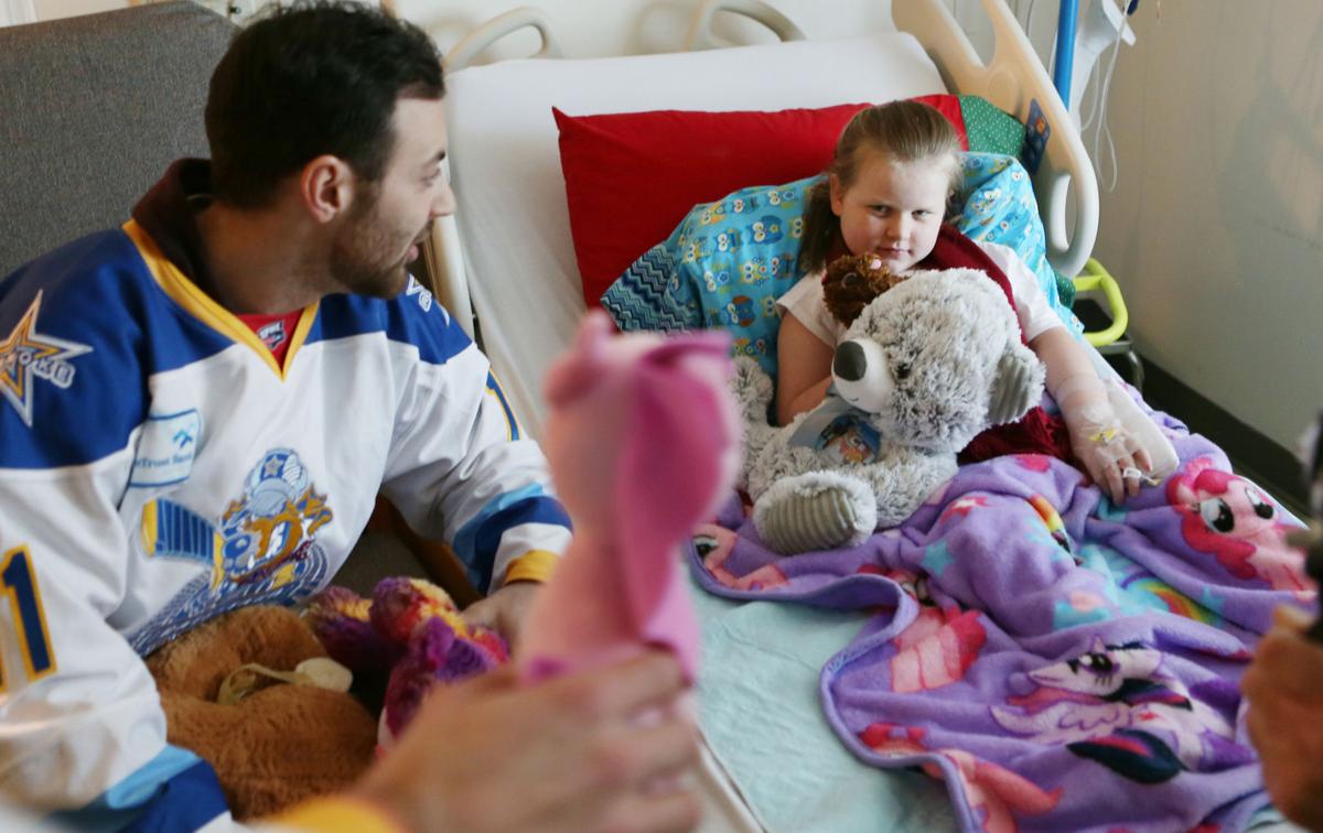 Rail Yard Dawgs deliver stuffed animals to children in hospital