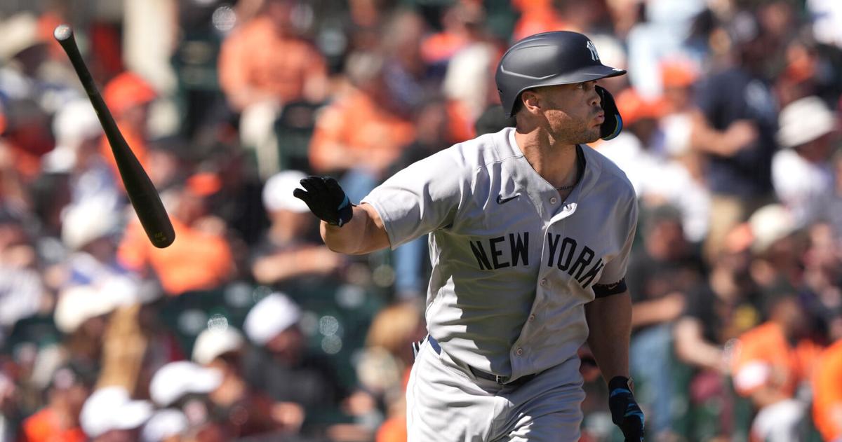 Mar 27, 2026; San Francisco, California, USA; New York Yankees designated hitter Giancarlo Stanton (27) tosses his bat after hitting a home run against the San Francisco Giants during the sixth inning at Oracle Park. Mandatory Credit: Darren Yamashita-Ima