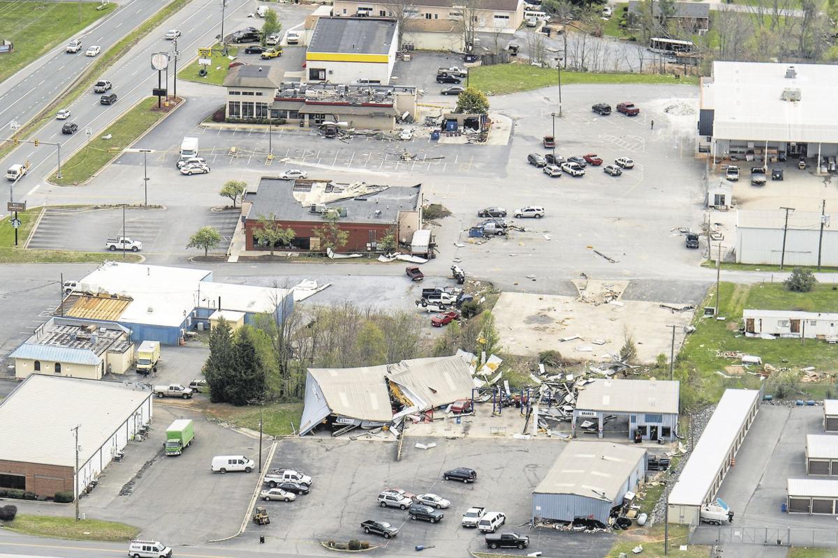 Wrapped in rain and difficult to see coming, tornado cuts 20mile path