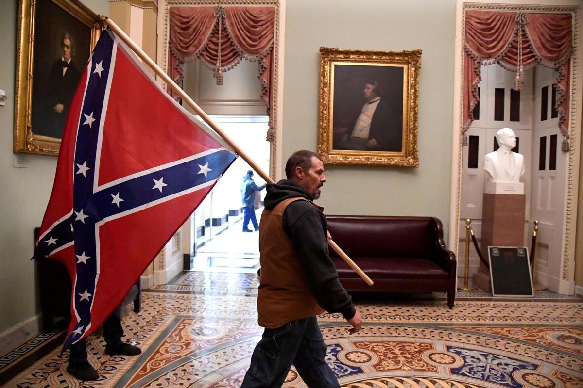 Man carrying Confederate flag inside US Capito