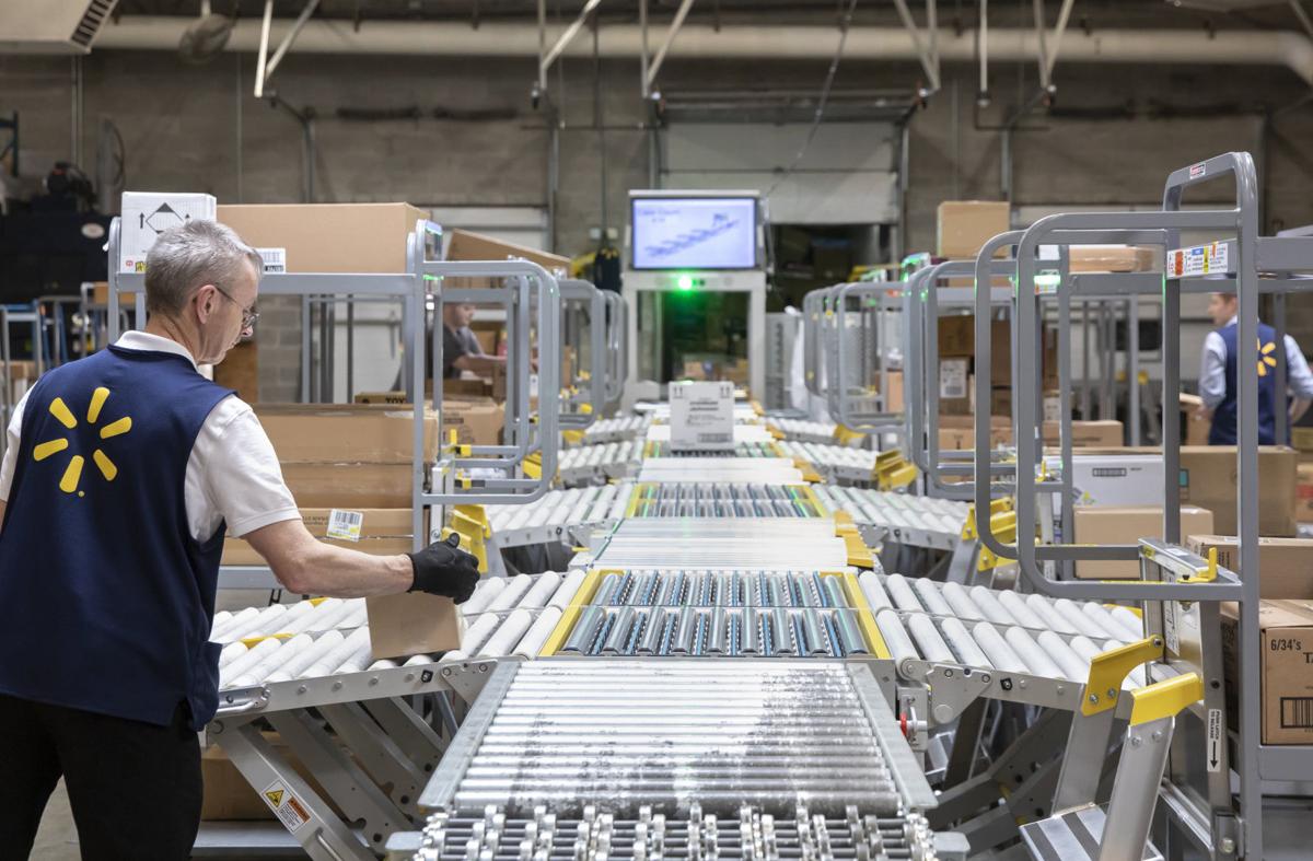 Walmart’s robot zips along in tech revolution that’s raising big