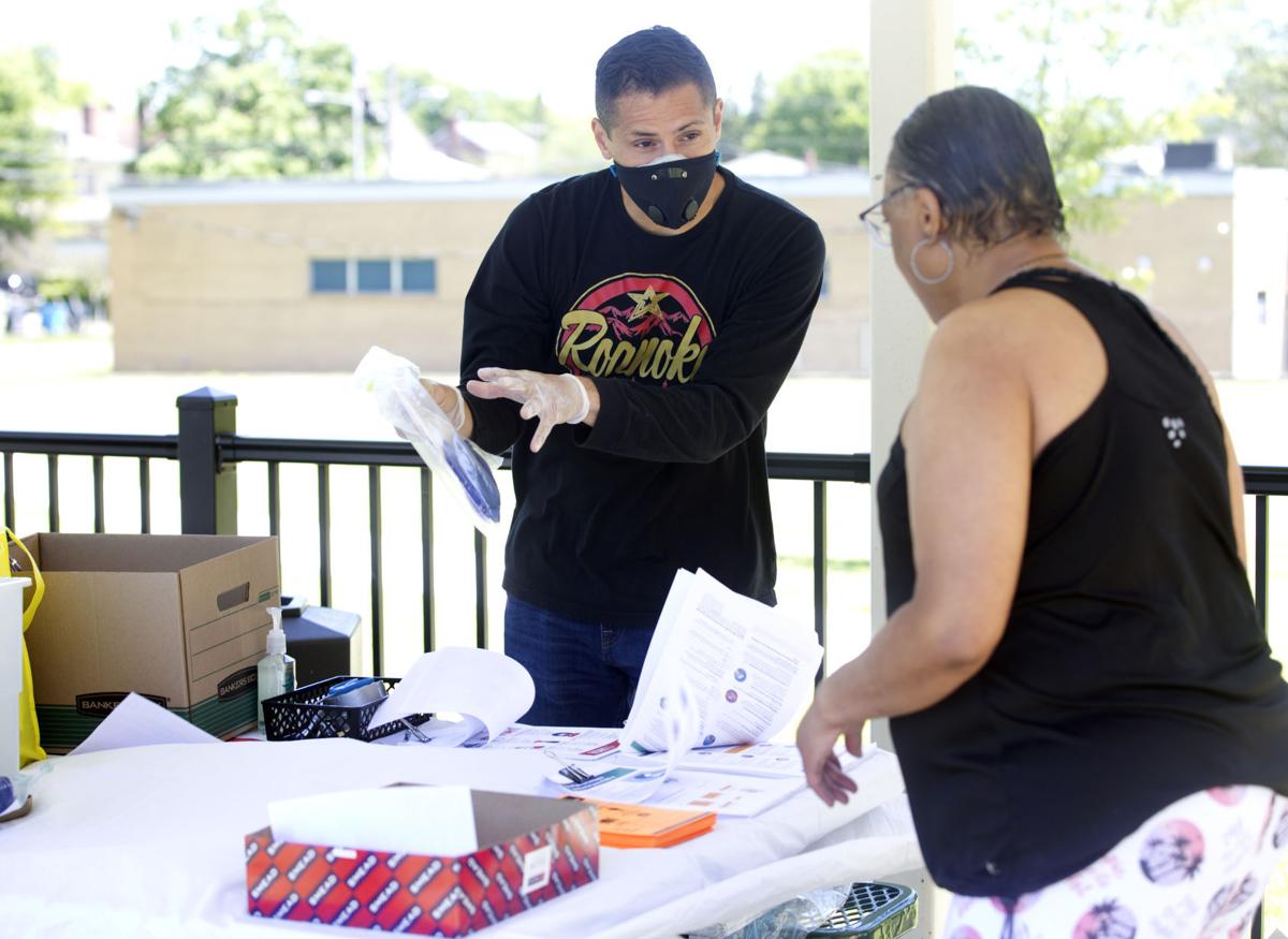 Del. Sam Rasoul, D-Roanoke, distributes masks