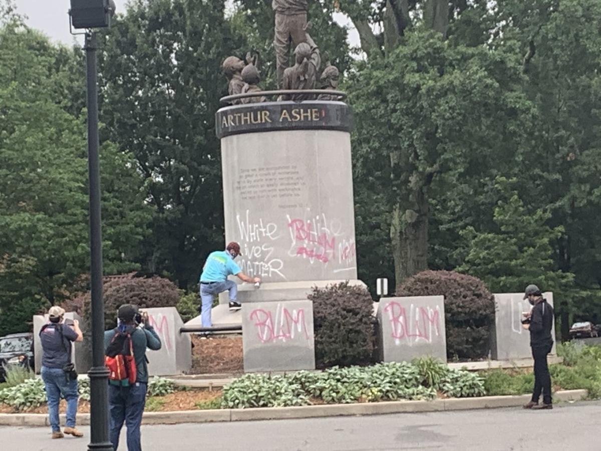 Arthur Ashe statue vandalized with 'White Lives Matter' graffiti in