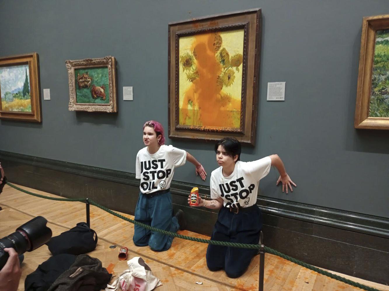 Photos Protesters throw soup on iconic Van Gogh painting