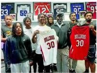 The Martinsville High School boys basketball team presents jerseys to