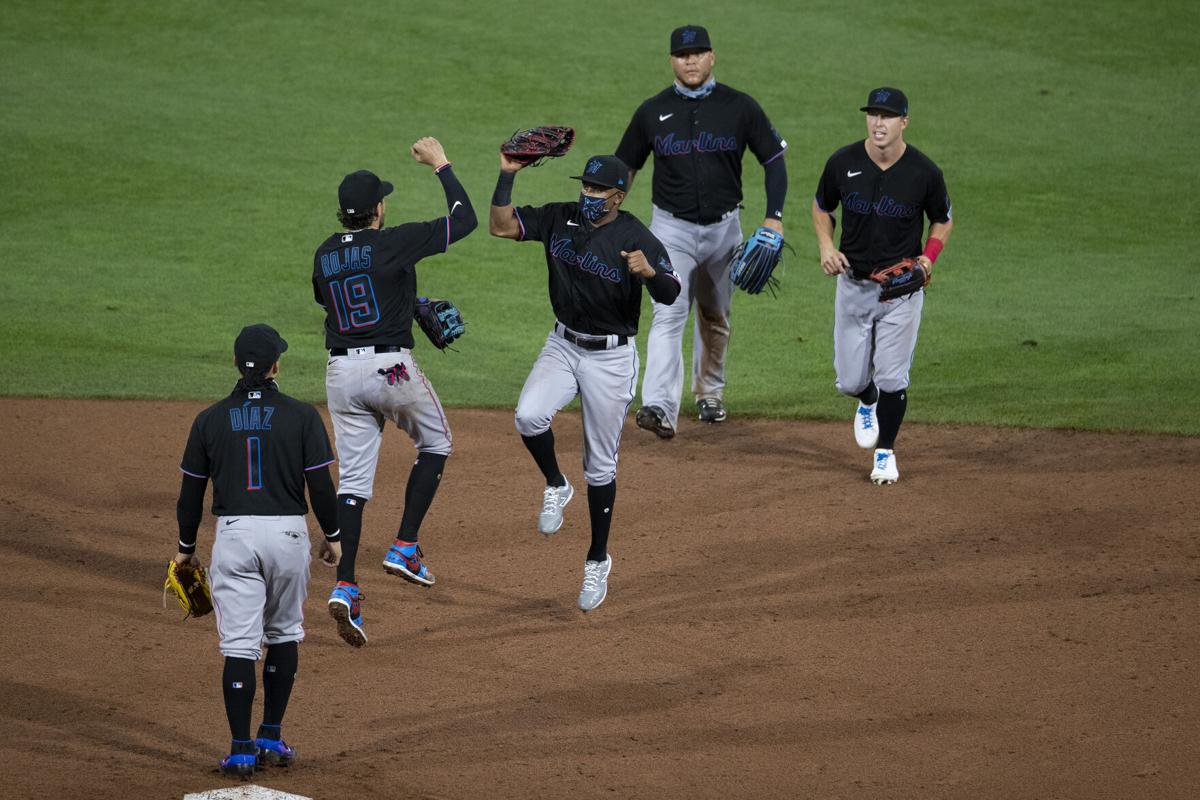 The Miami Marlins celebrate a 5-2 win on Opening Day against the Philadelphia Phillies at Citizens Bank Park on July 24, 2020, in Philadelphia.