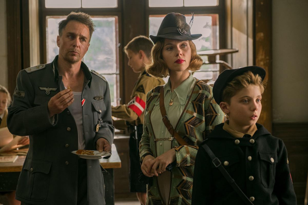 Sam Rockwell (Captain Klezendorf), Scarlet Johansson (Rosie Betzler) and Roman Griffin Davis (Jojo Betzler) in Jojo Rabbit.