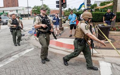 'People just falling and falling': Witnesses describe terror at Illinois parade shooting