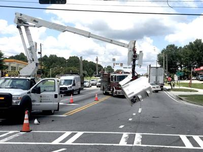 Worker left hanging after bucket truck hit