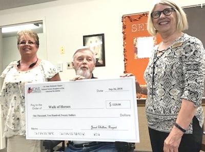 Colonel John McIntosh Chapter, NSDAR presents check to Walk of Heroes