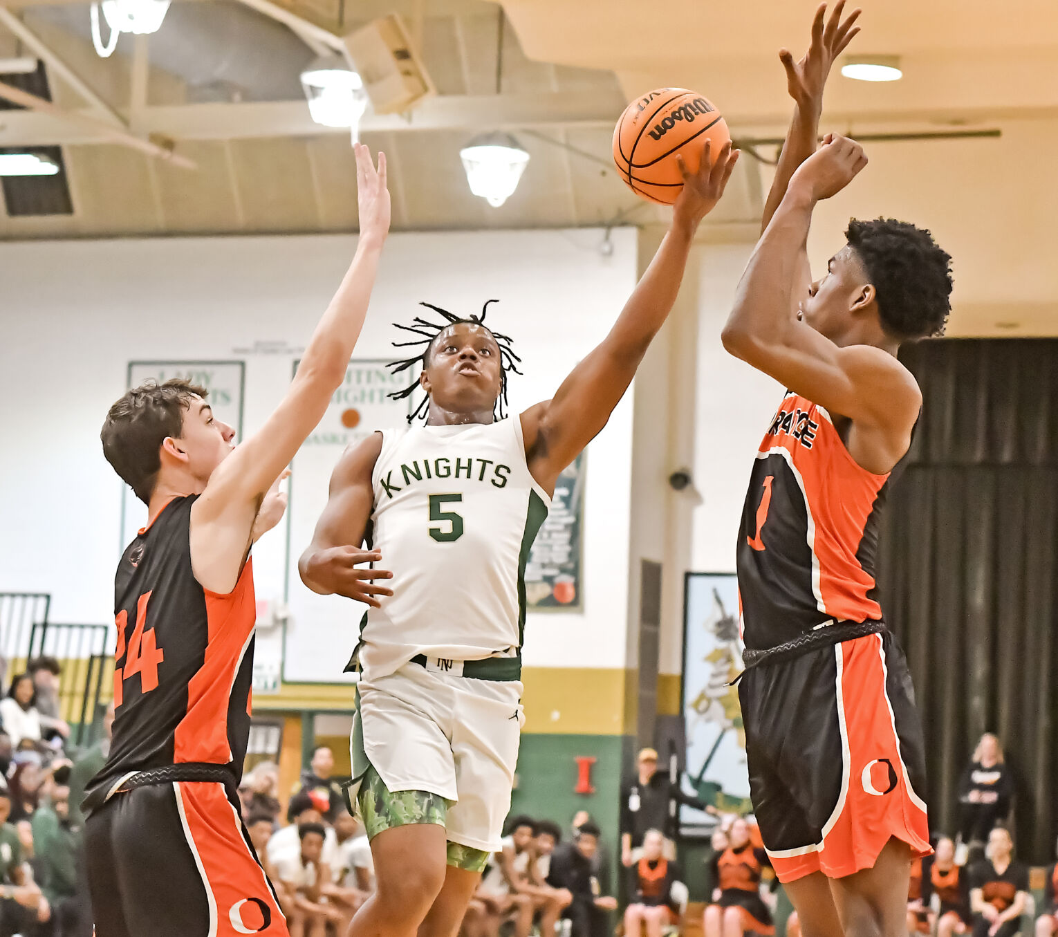 NN Boys Basketball Secures 15th Win & Third Playoff Round Spot with Late Game Sweep