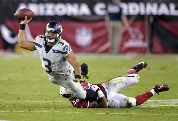 Wilson, Lynch lead Seattle past Cardinals, 33-22