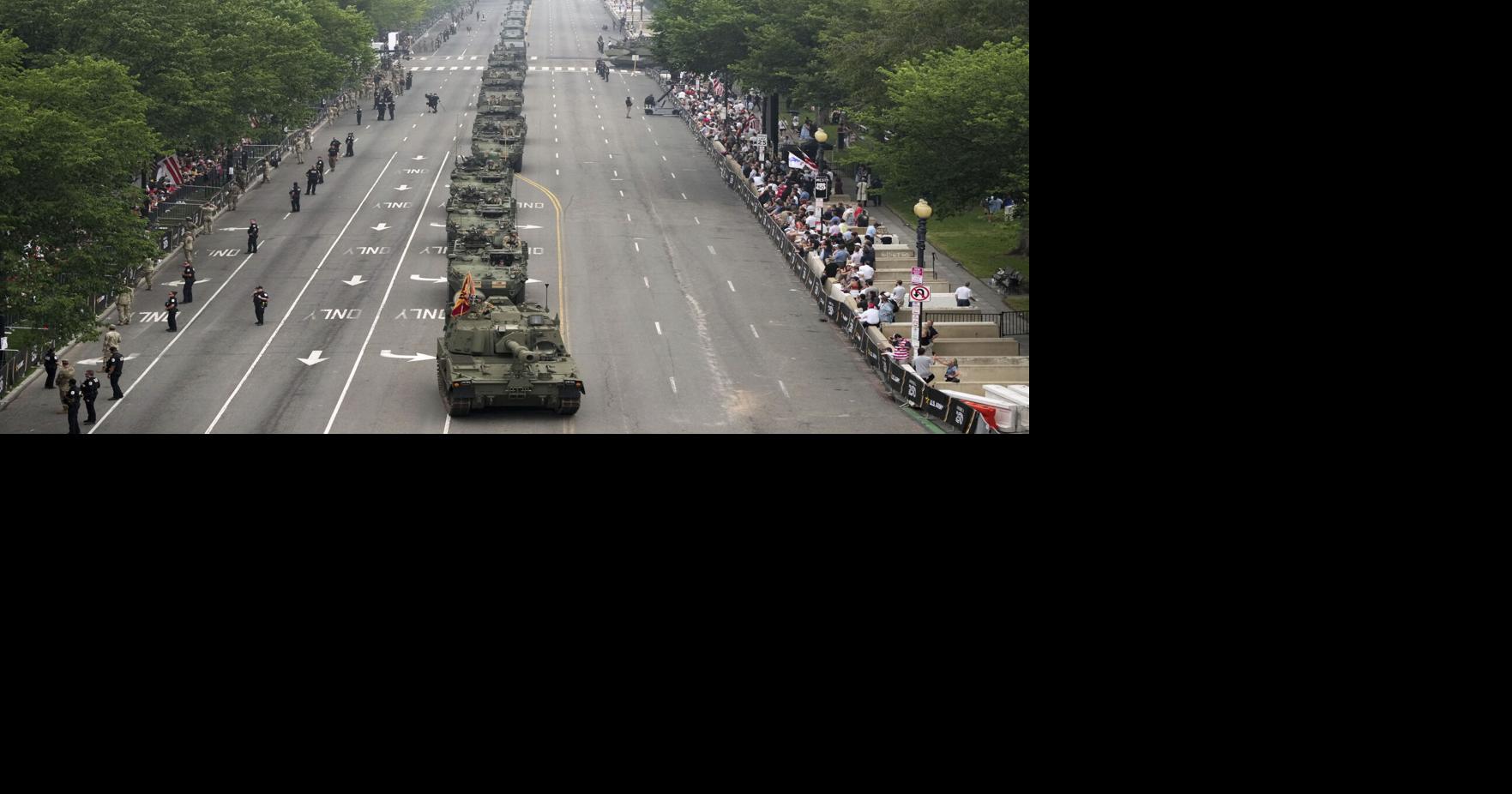 Military parade features helicopter flyover as LA police disperse protest