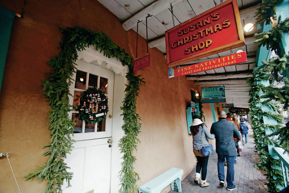 Two Santa Fe Christmas stores, across street from each other downtown