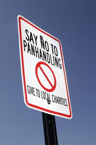 Signs ask drivers give to charity, not panhandlers