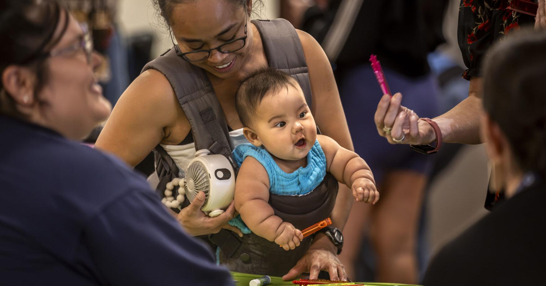 Despite rain , attendance strong at yearly south - side business fair