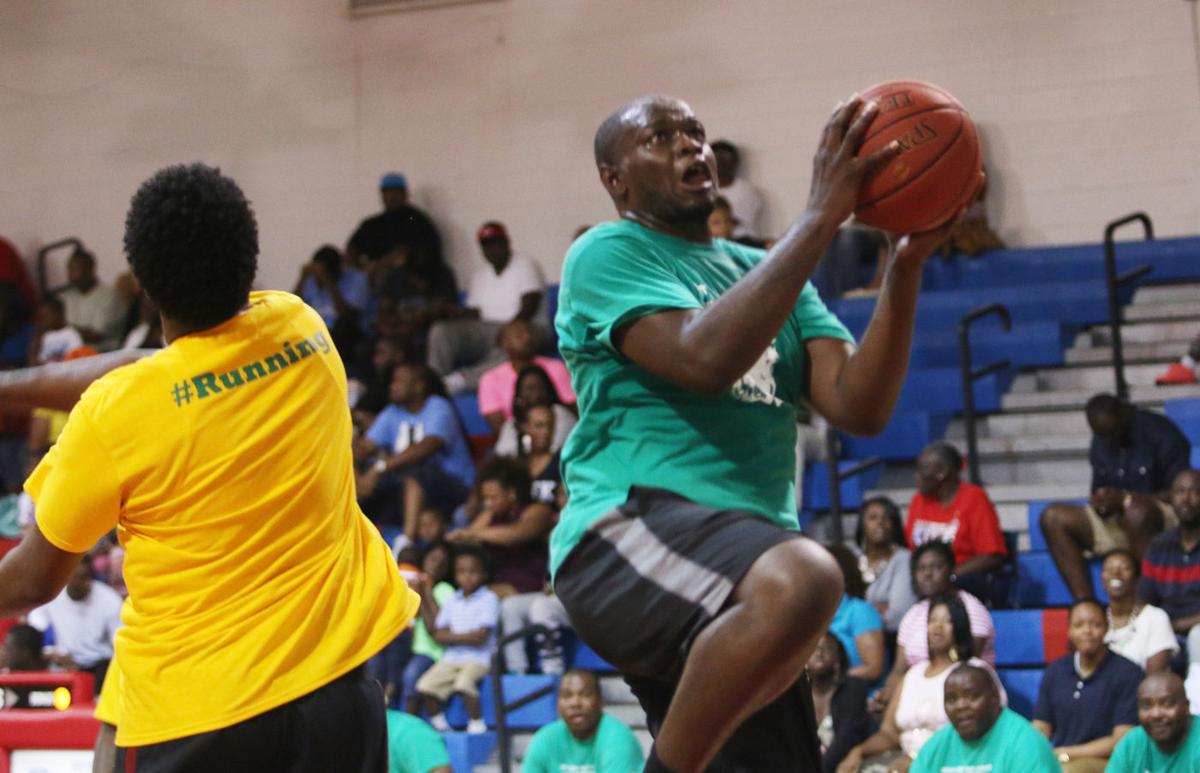 Former high school basketball players get competitive in honor of Coach