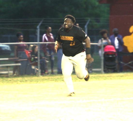Phillip Simmons holds-off Marion 12-8
