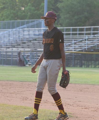 Phillip Simmons holds-off Marion 12-8