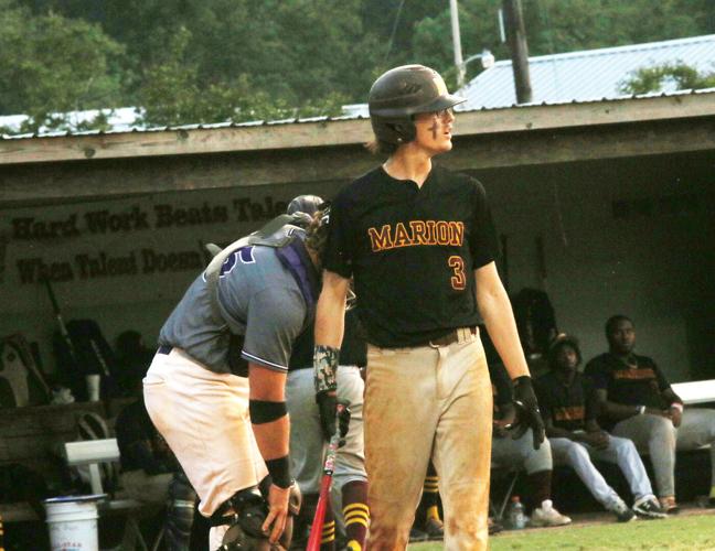 Phillip Simmons holds-off Marion 12-8