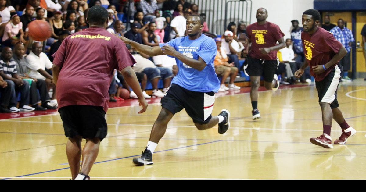 Former high school basketball players get competitive in honor of Coach