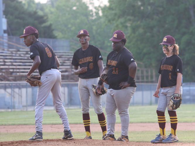 Phillip Simmons holds-off Marion 12-8