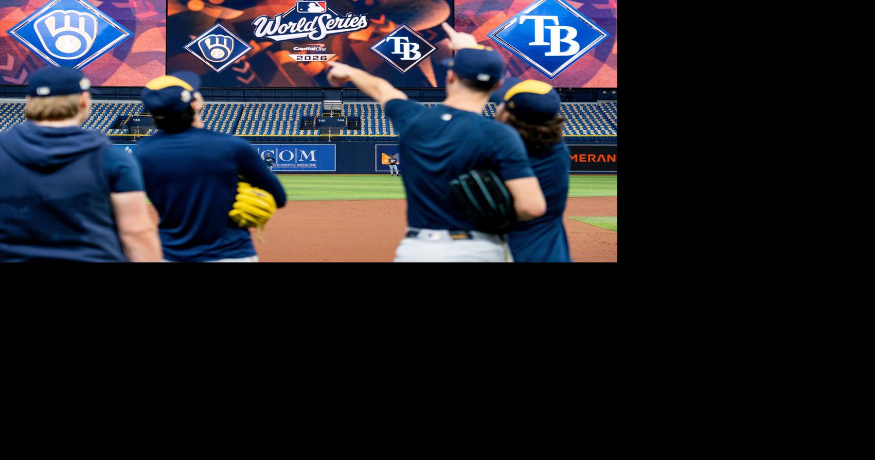Milwaukee Brewers players point towards a fly ball during a workout and practice session ahead of Game 3 of the World Series