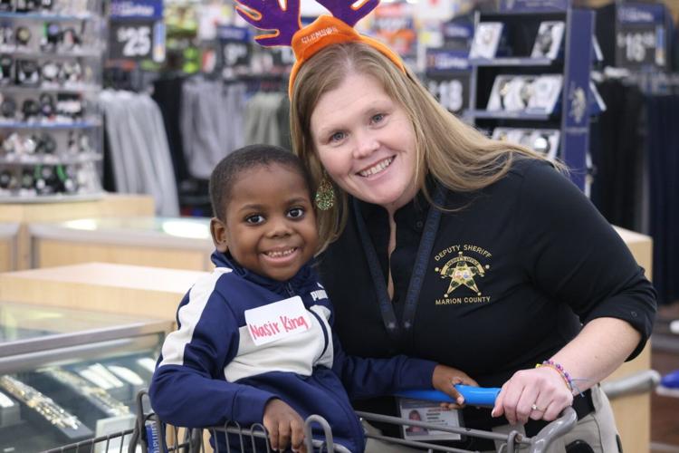 Marion County Sheriff’s Office treat 50 children to 'Shop with a Cop' experience