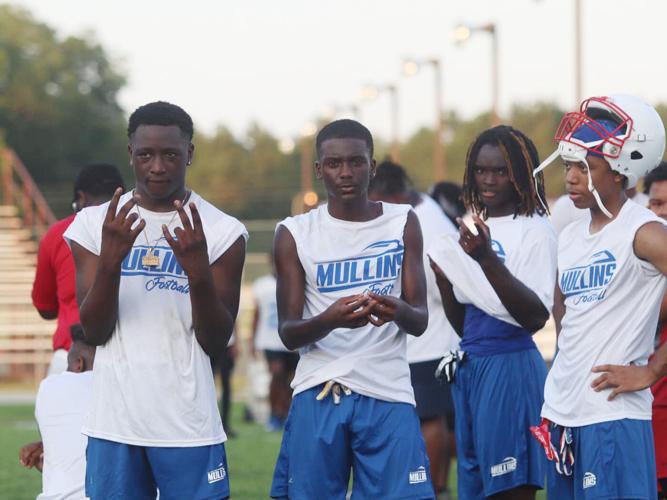 New Mullins football coach taking advantage of time with team during FCA passing league