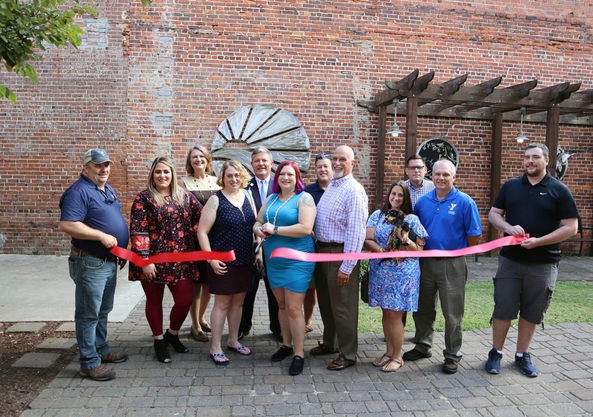 Lauren Piner with eXp Realty celebrates with ribbon cutting
