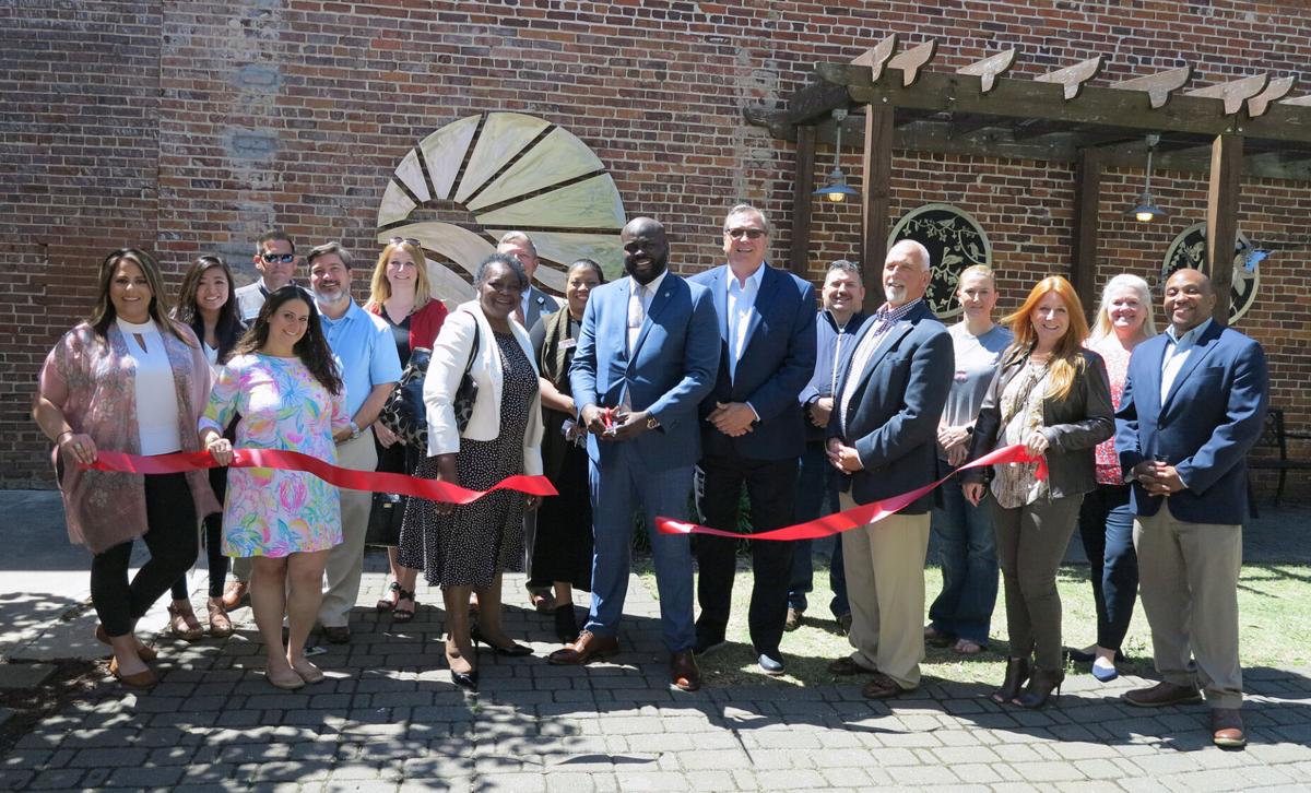 VBC LP chamber ribbon cutting held in the James Allen Plaza