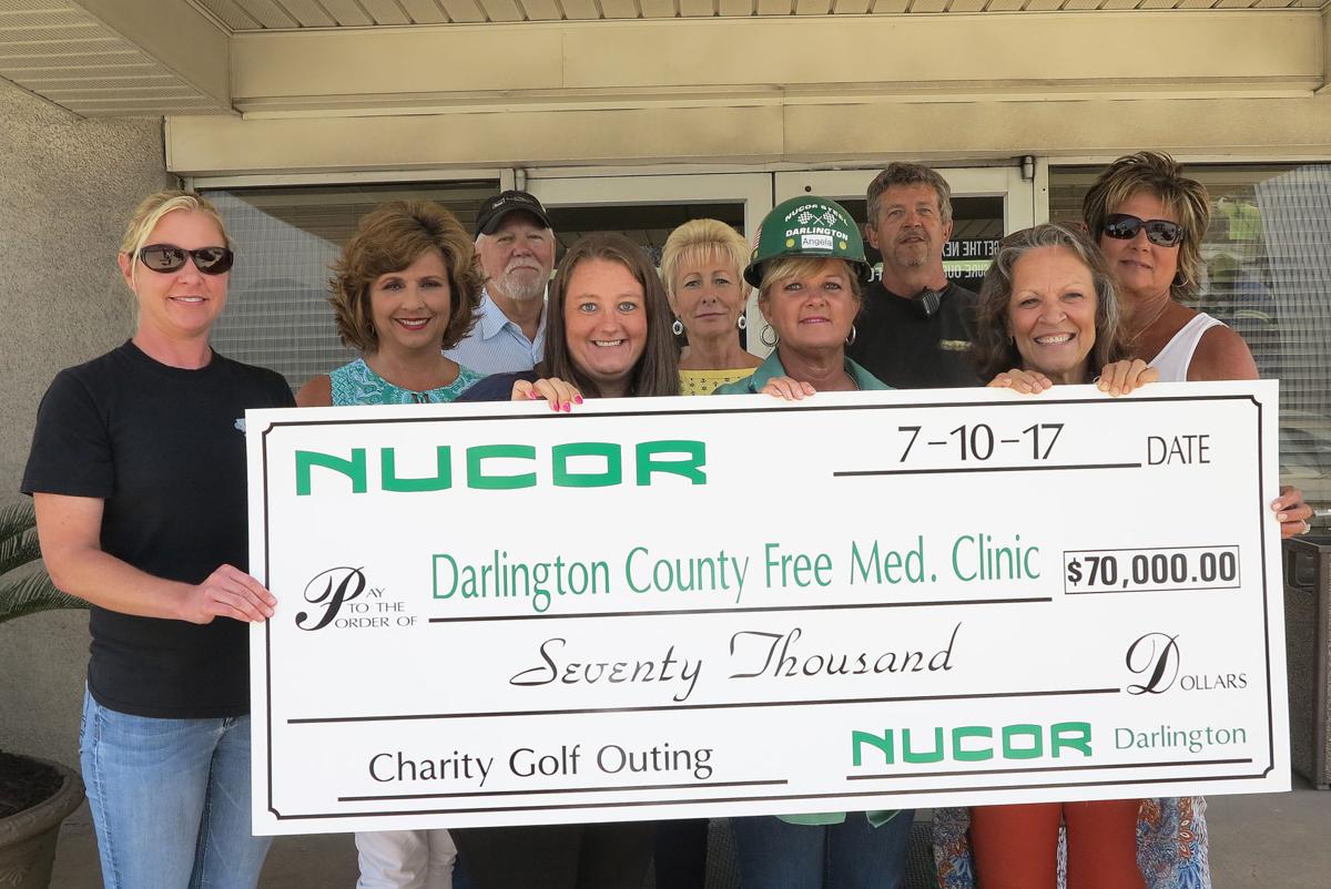 Nucor presents Darlington County Free Medical Clinic with a check for