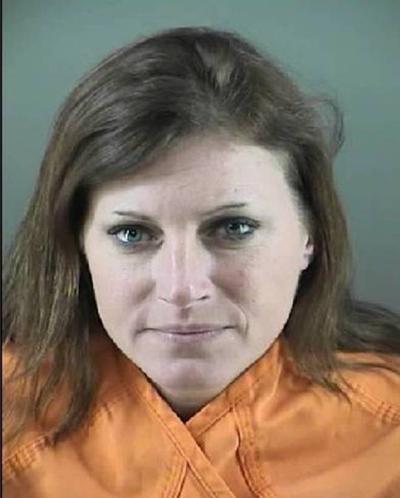 Woman charged with photographing underage girls having sex