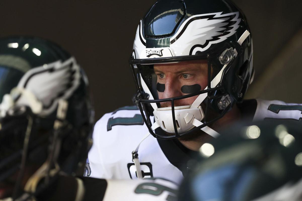 Eagles quarterback Carson Wentz stands in the tunnel before taking on the Arizona Cardinals at State Farm Stadium in Glendale, Ariz. on Sunday, Dec. 20, 2020.