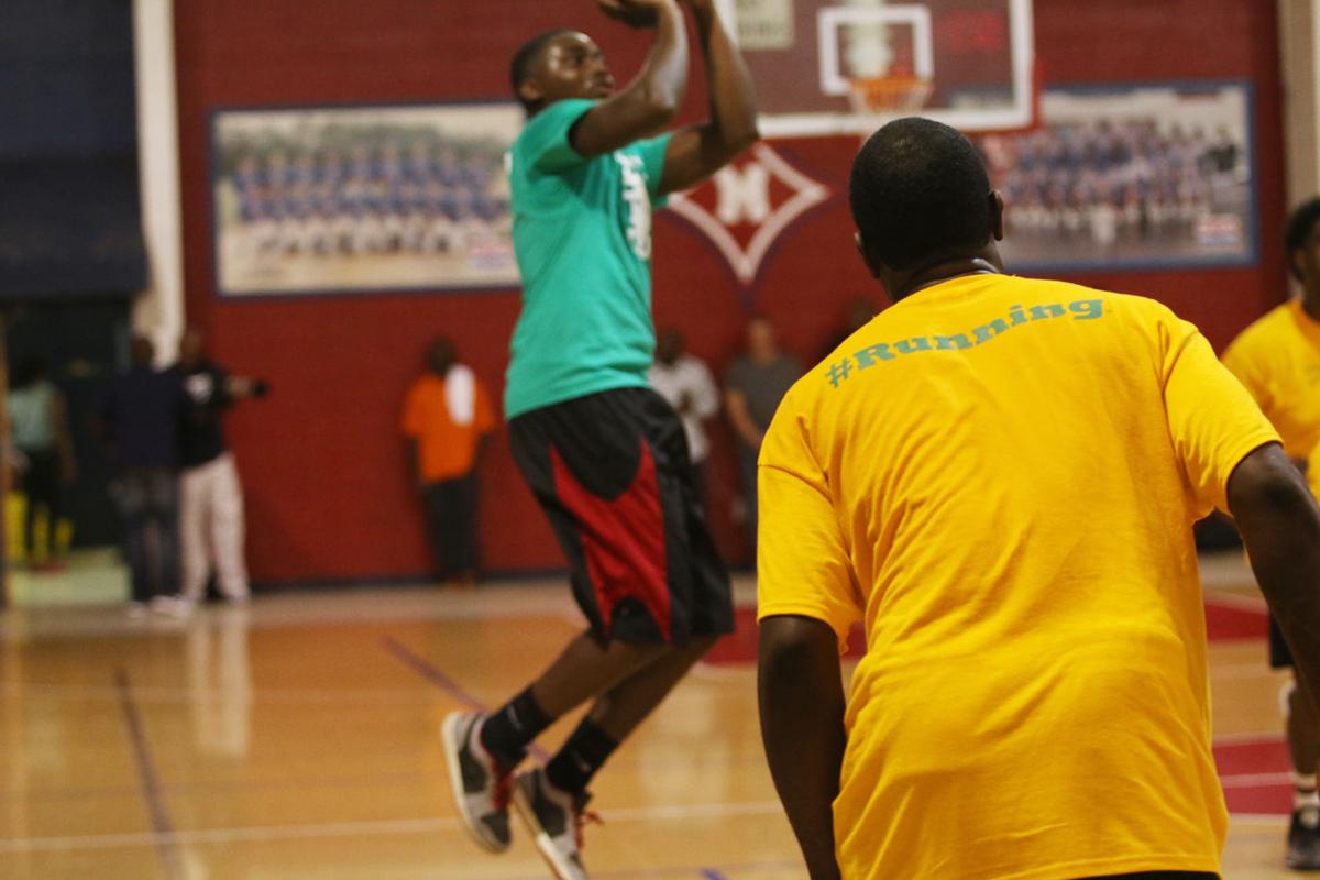 Former high school basketball players get competitive in honor of Coach