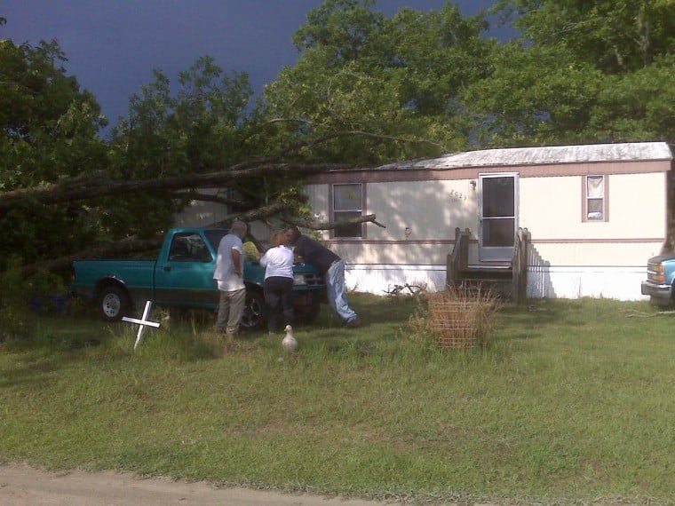 Family Escapes Mobile Home After Tree Falls On Top