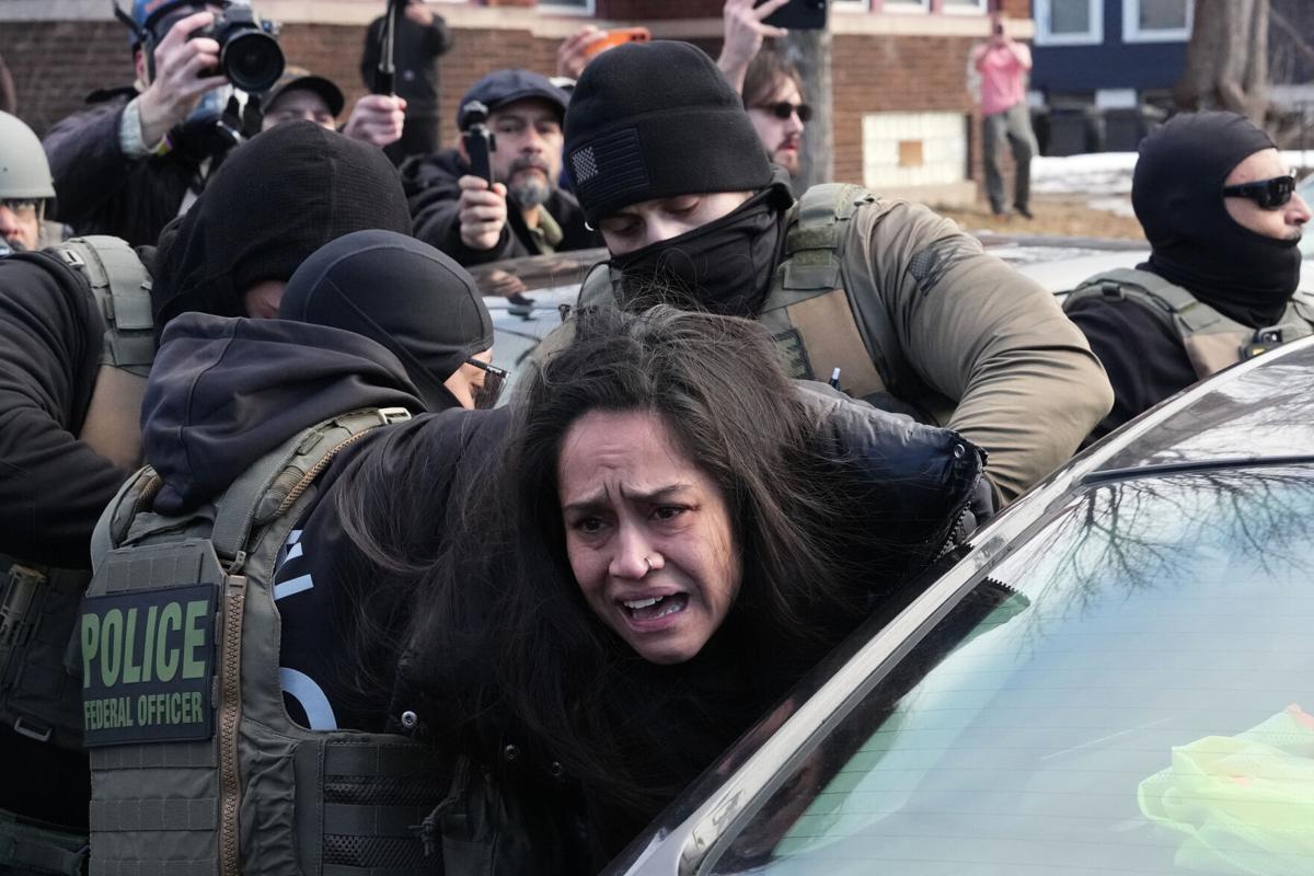 Federal authorities filmed dragging a woman from car
