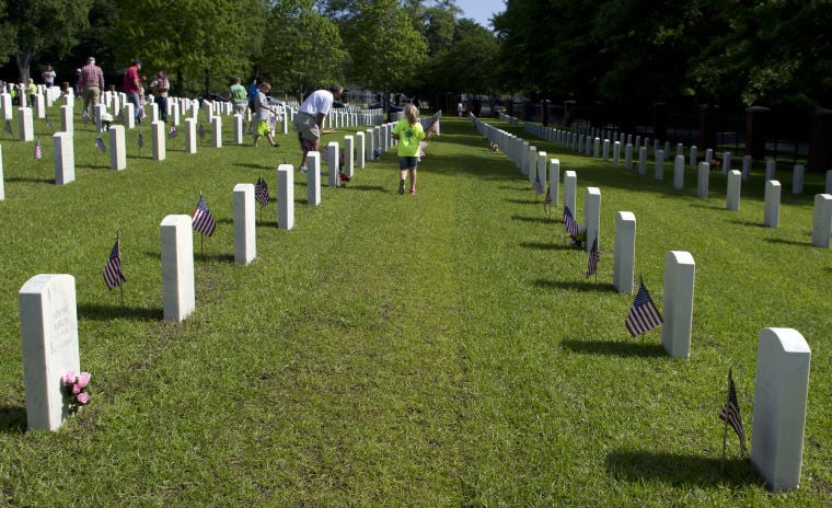 GALLERY: Volunteers place 12,000 flags at Florence National Cemetery ...