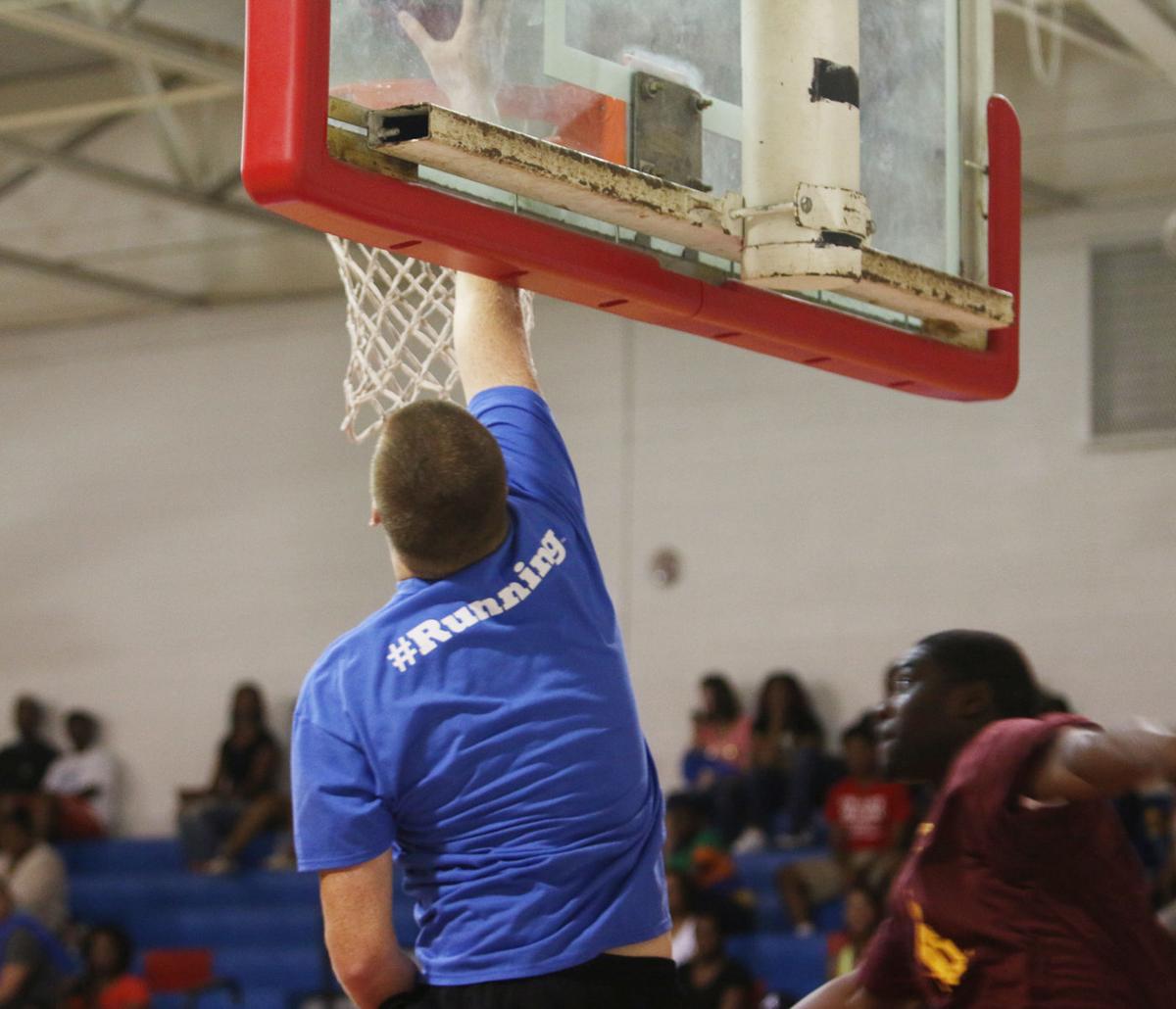 Former high school basketball players get competitive in honor of Coach