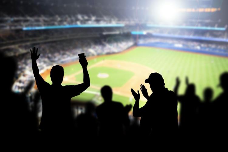 Baseball fans and crowd cheering in stadium and watching the game in ballpark. Happy people enjoying a match and sport event in arena. Friends watching ballgame live.